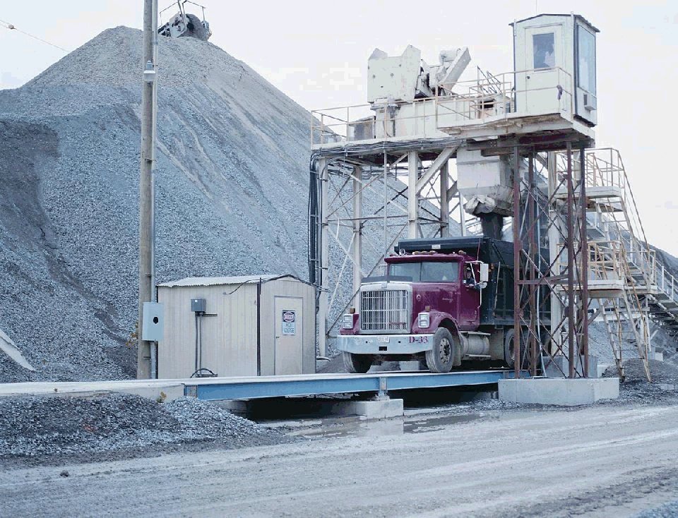 aggregate being loaded into truck on scale
